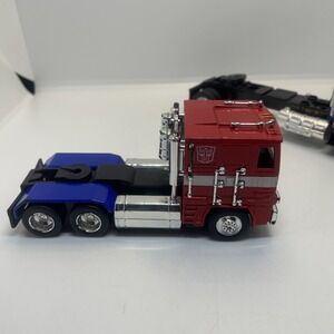 JADA Transformers Autobit Optimus Prime Red,Blue, Kenworth Too.